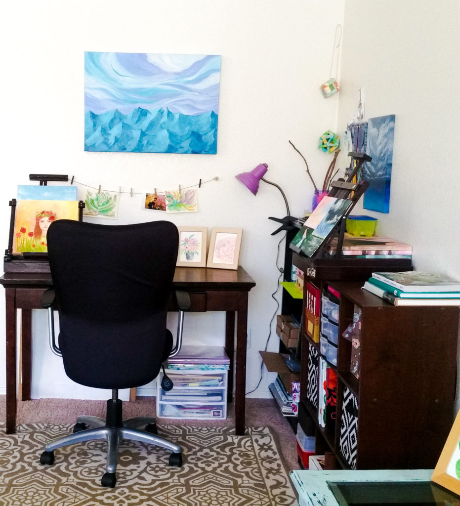 corner art studio with chair, desk and shelving